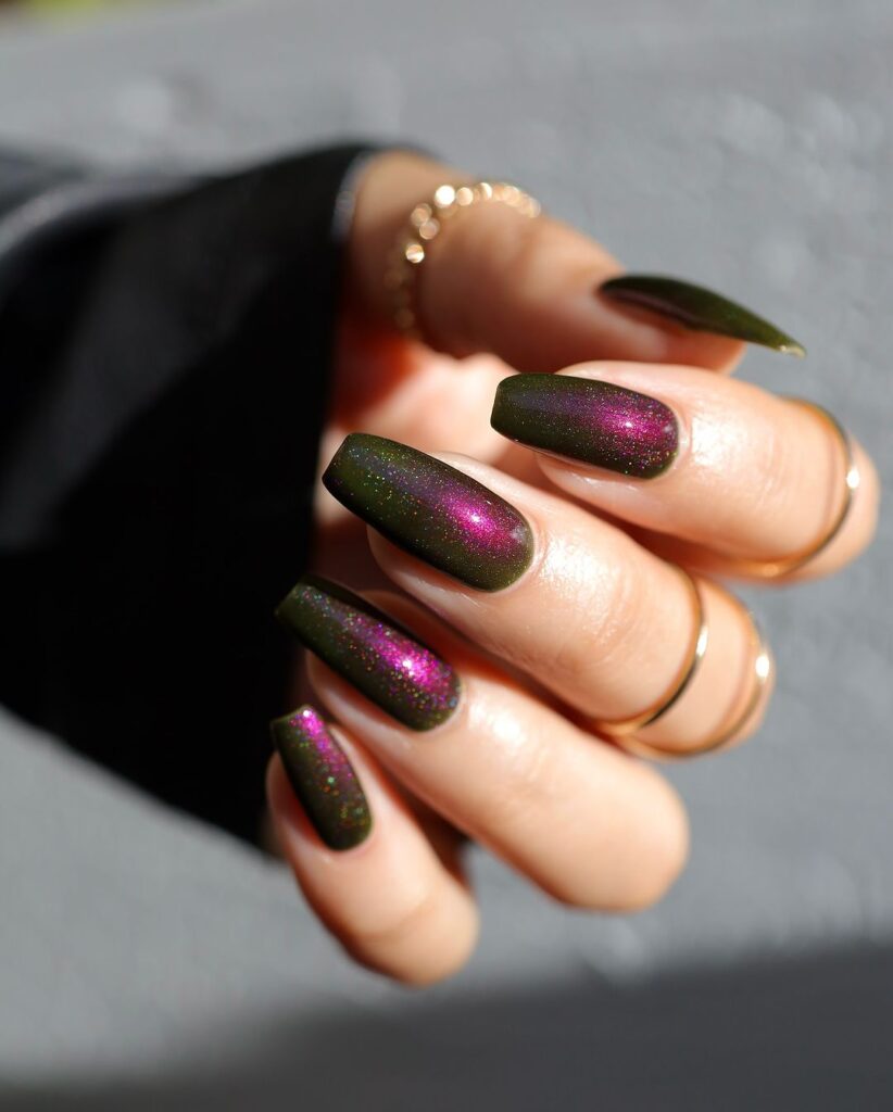 Fall nail design with a dark green base and rich burgundy shimmer, capturing a mysterious and enchanting autumn vibe